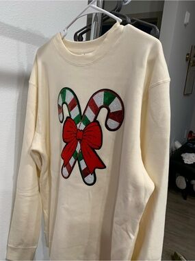 Cream Sweatshirt with Festive Candy Cane Patch
